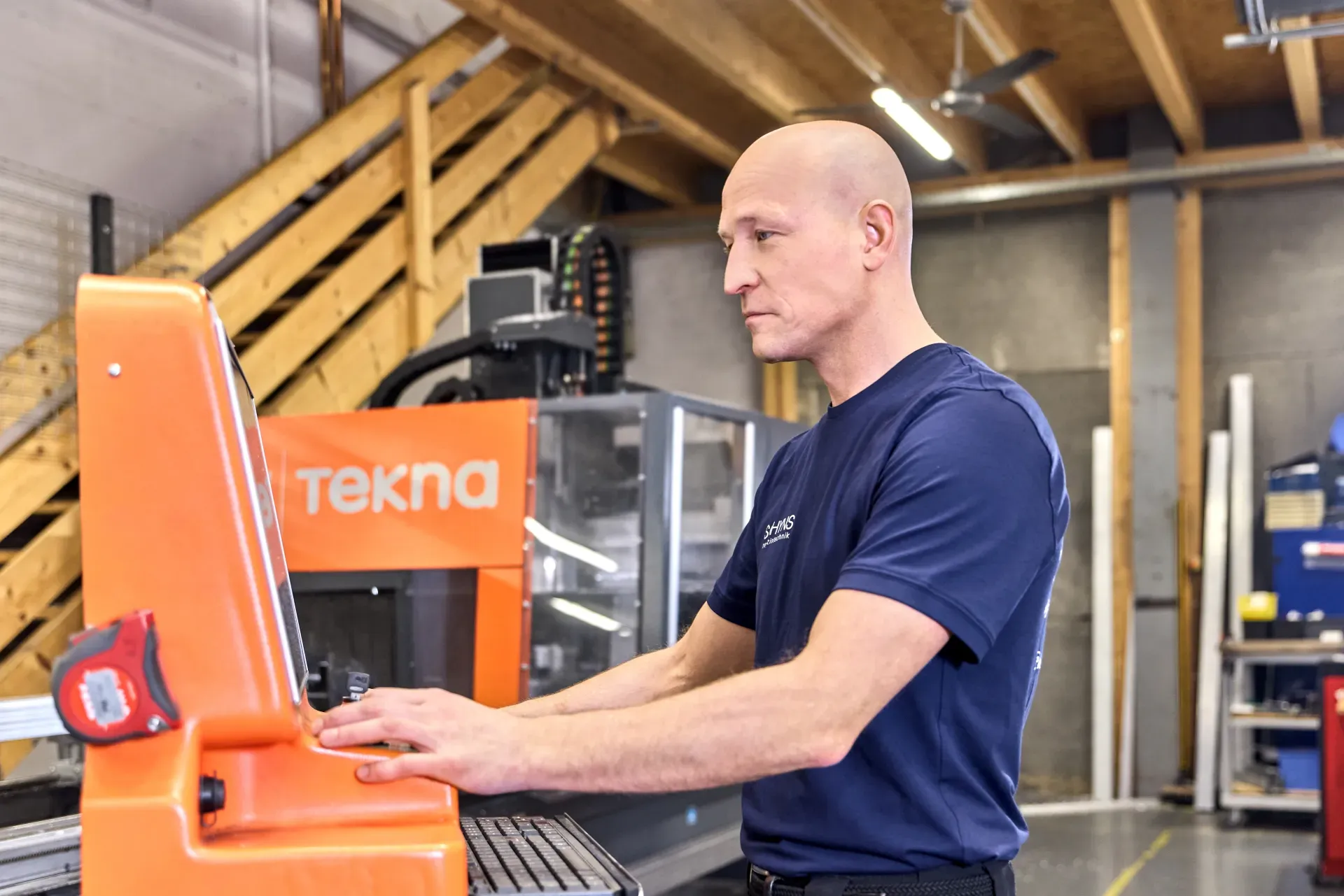 An employee operates a machine.